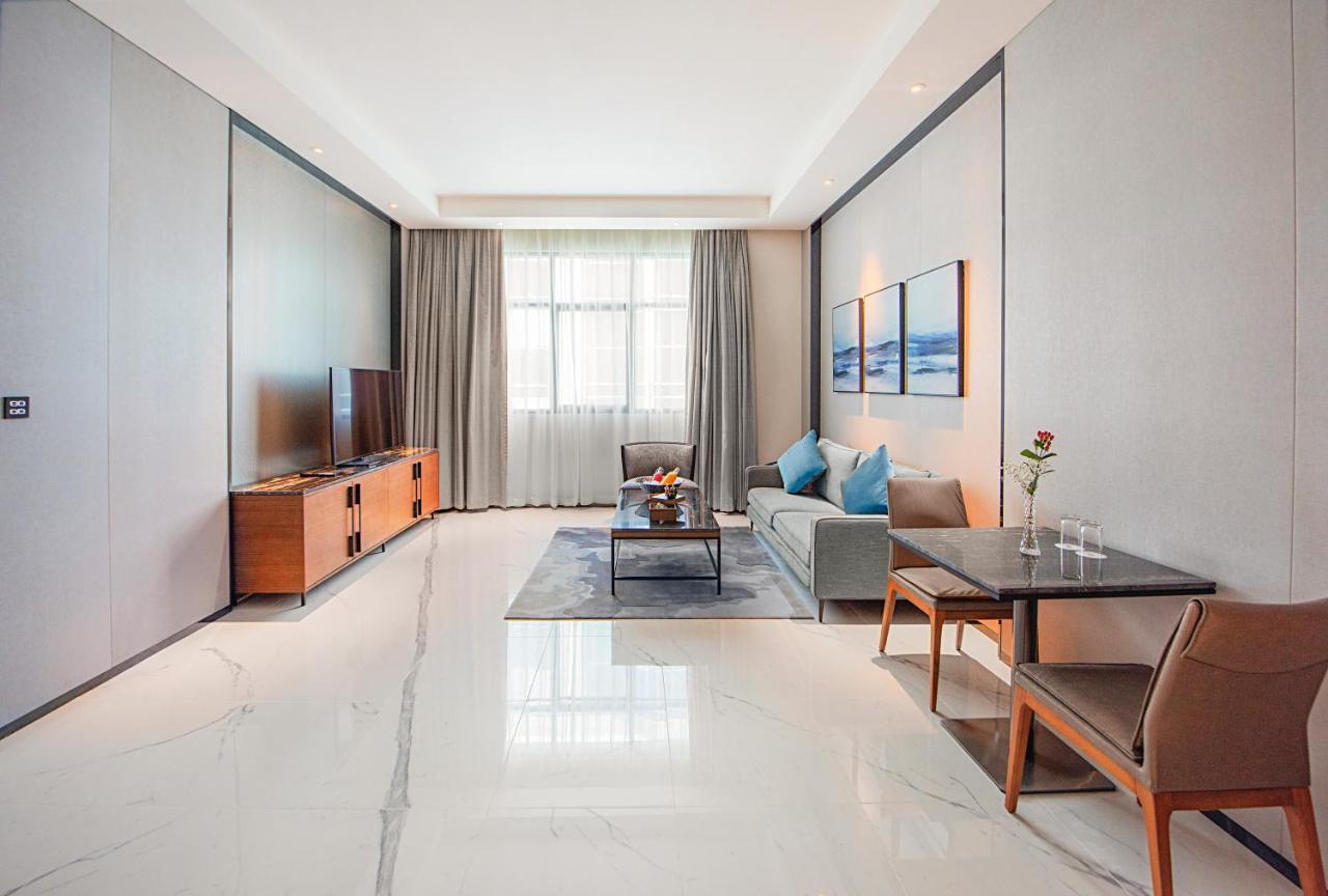 Asiana Grand Hotel Дубай Екстериор снимка A living room in a serviced apartment in Beijing, China